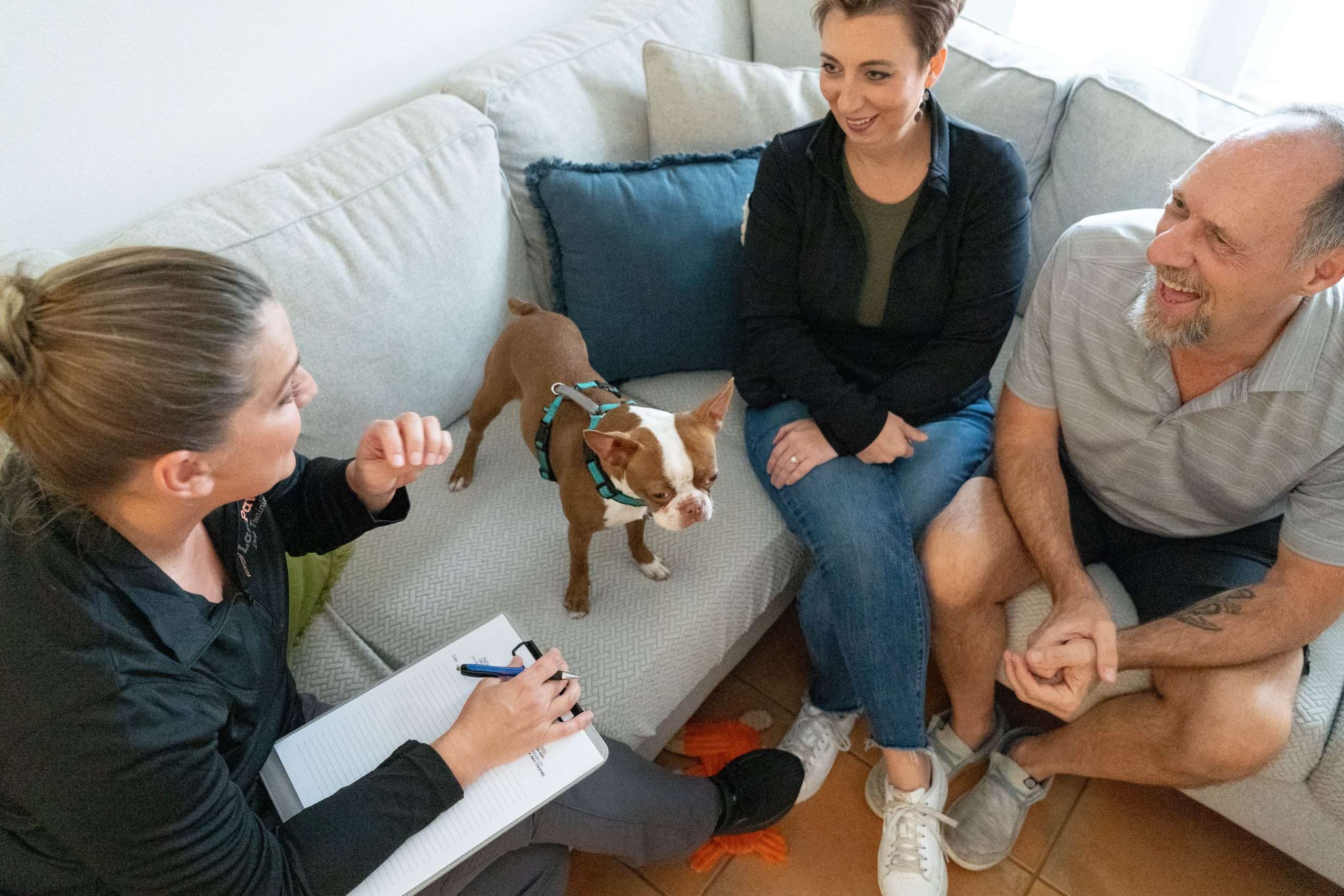 Dog Training Services in Bradenton & Sarasota 3 Cheryl talking with couple about supportive behavior training